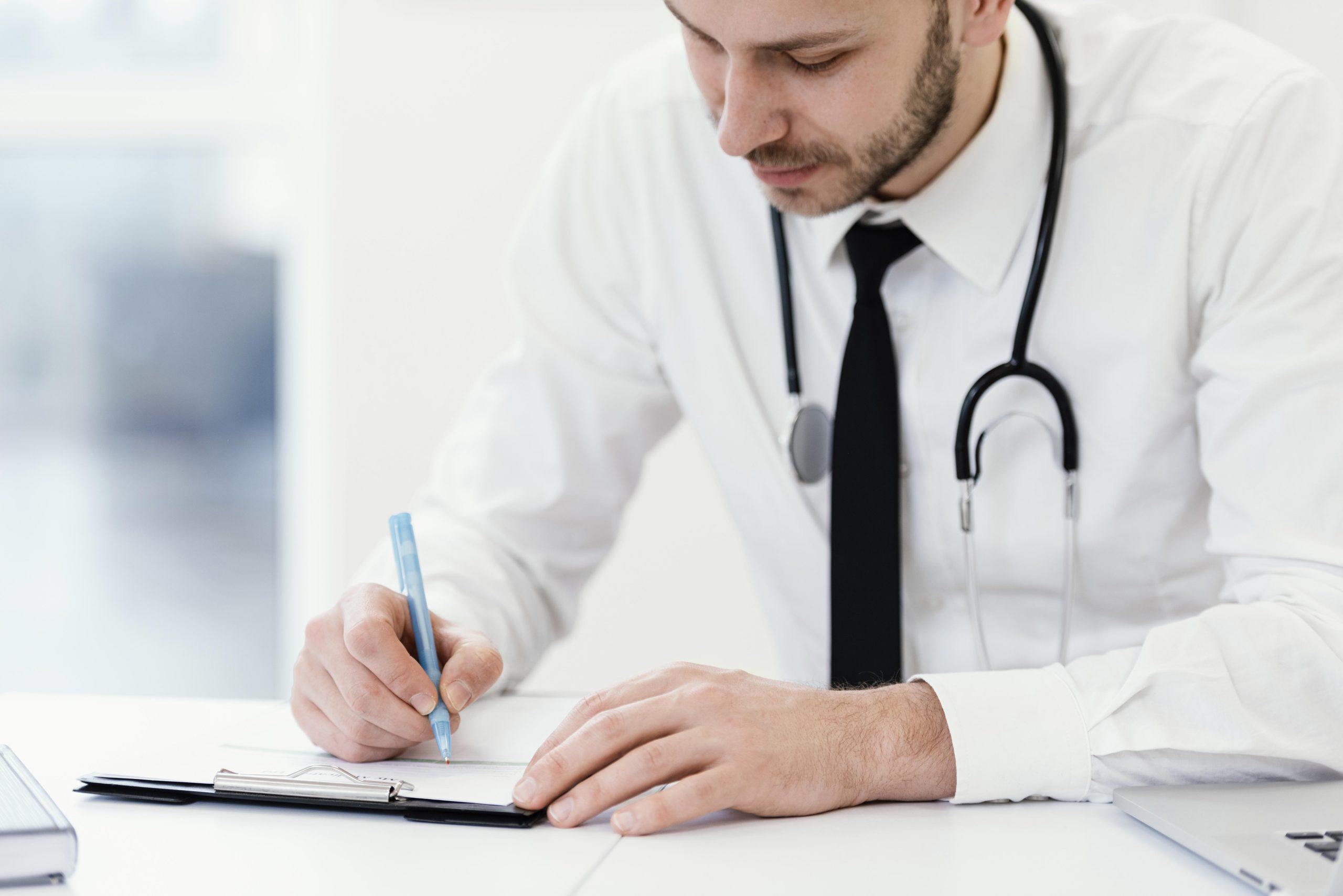 close-up-doctor-writing
